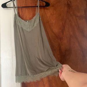 Olive green tank size xs fits like a small